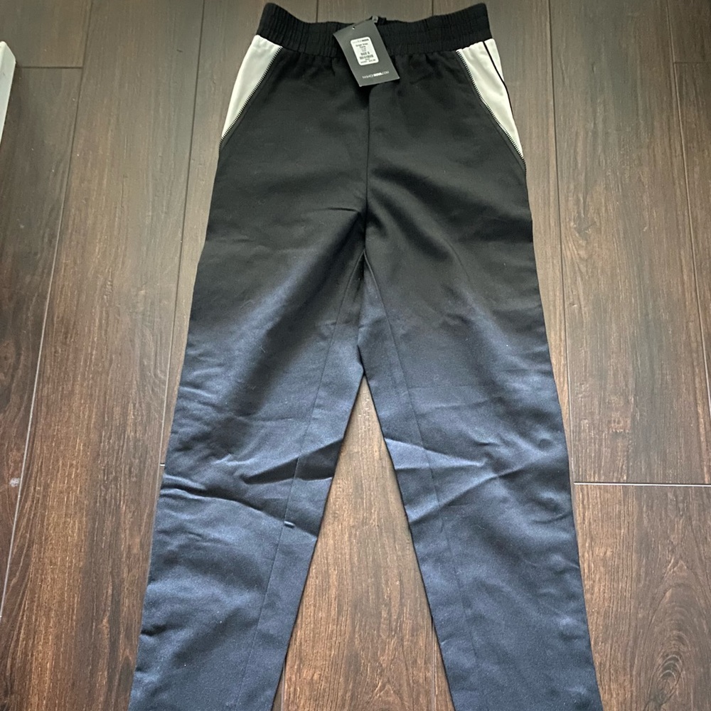 Tapered trouser pants with button leg closure